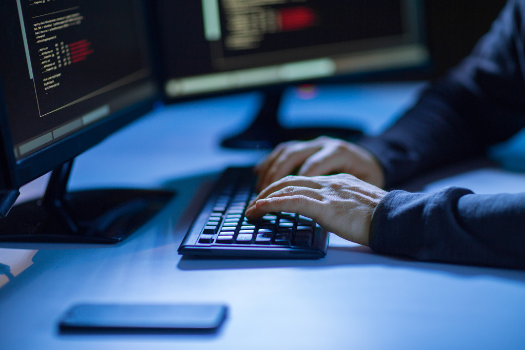 person typing on a keyboard