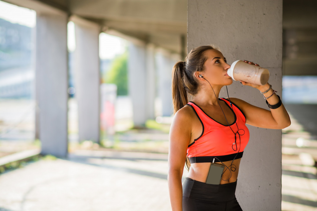 A woman exercising while listening to music