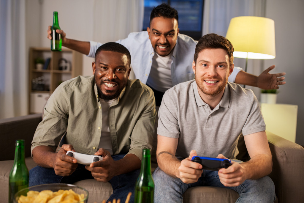 A bunch of friends playing a video game together