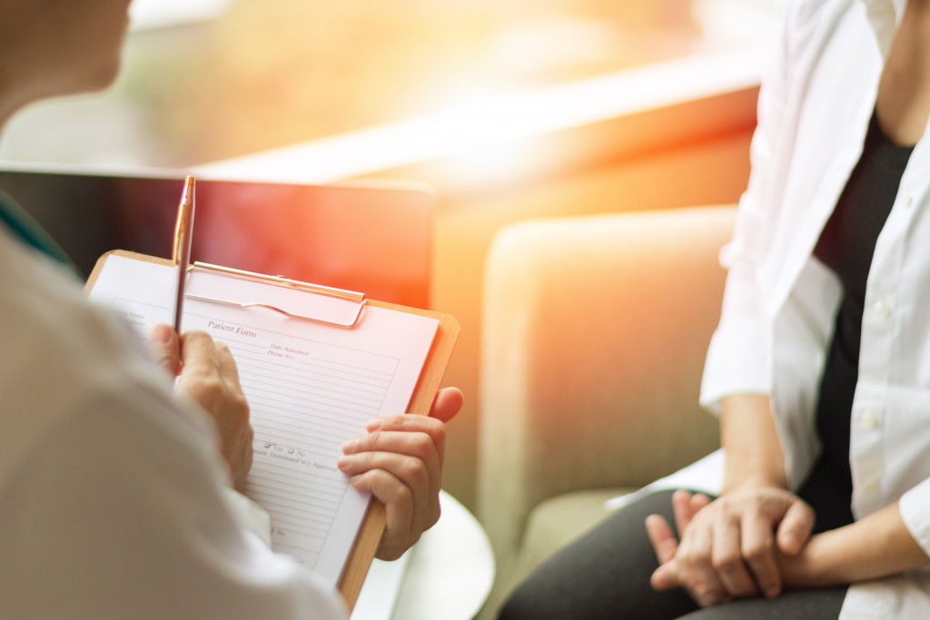 therapist or counselor talking to patient