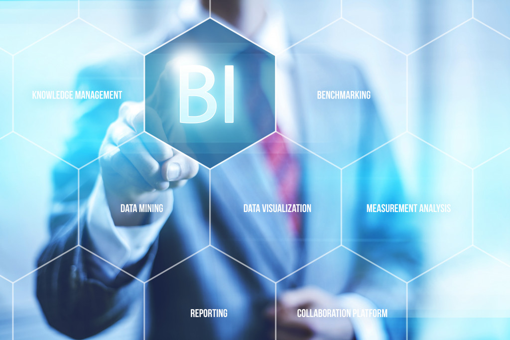 business man pointing to business intelligence